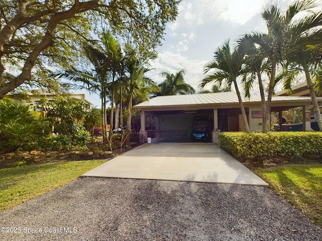 exterior space with a carport