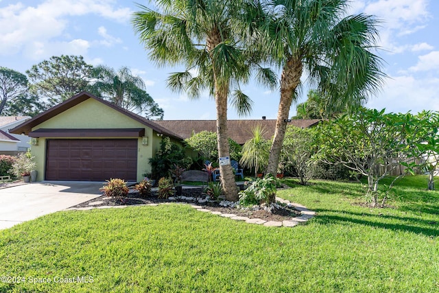 ranch-style home featuring a garage and a front yard