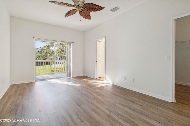 empty room featuring light hardwood / wood-style floors and ceiling fan