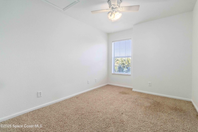 carpeted empty room featuring ceiling fan