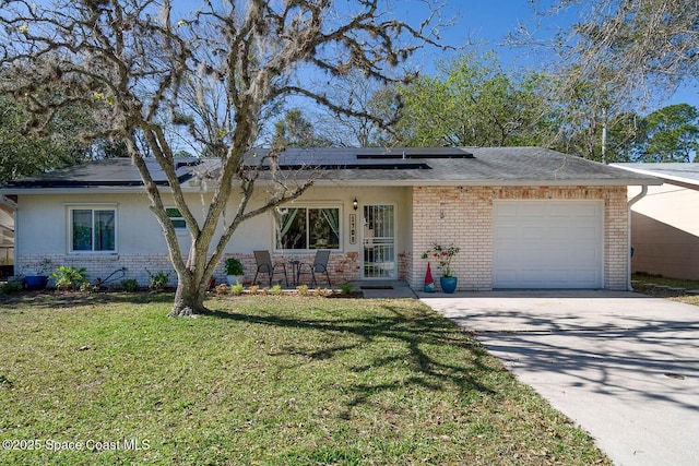 view of front facade with solar panels, a garage, and a front lawn