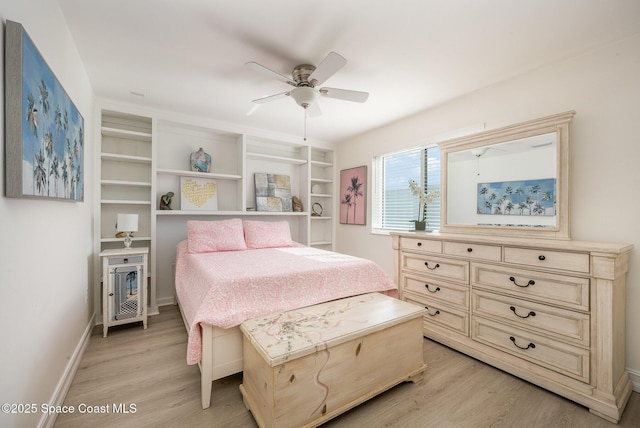 bedroom with ceiling fan and light hardwood / wood-style floors