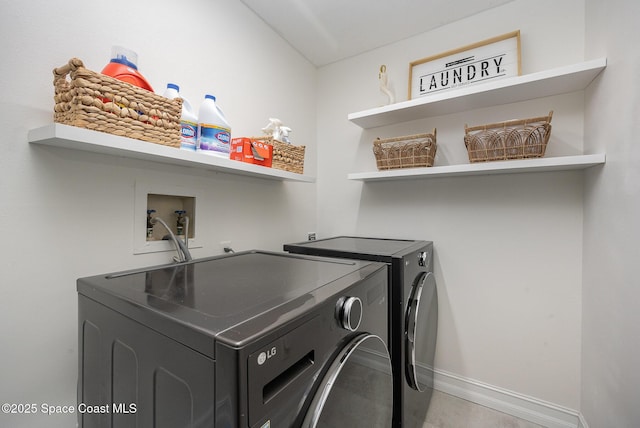 laundry room featuring separate washer and dryer