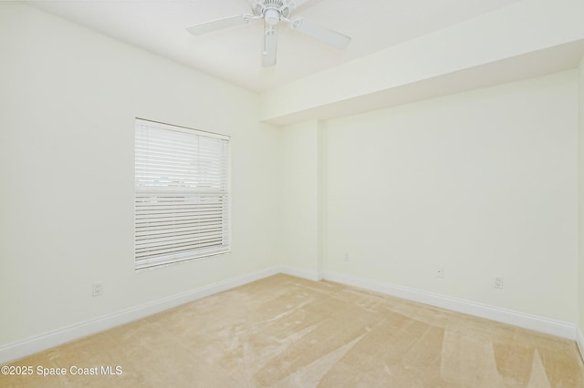 spare room with ceiling fan and carpet flooring