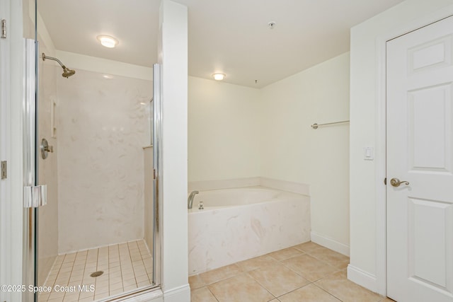 bathroom with plus walk in shower and tile patterned flooring