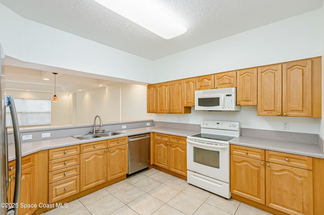 kitchen featuring pendant lighting, white appliances, a textured ceiling, sink, and light tile patterned floors