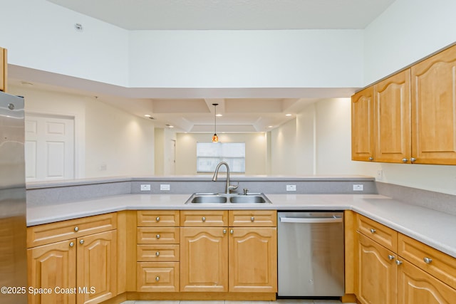 kitchen with sink, stainless steel dishwasher, decorative light fixtures, and kitchen peninsula