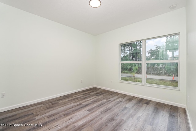 spare room featuring hardwood / wood-style flooring