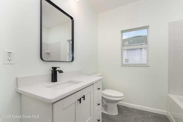 bathroom featuring vanity, tile patterned floors, and toilet