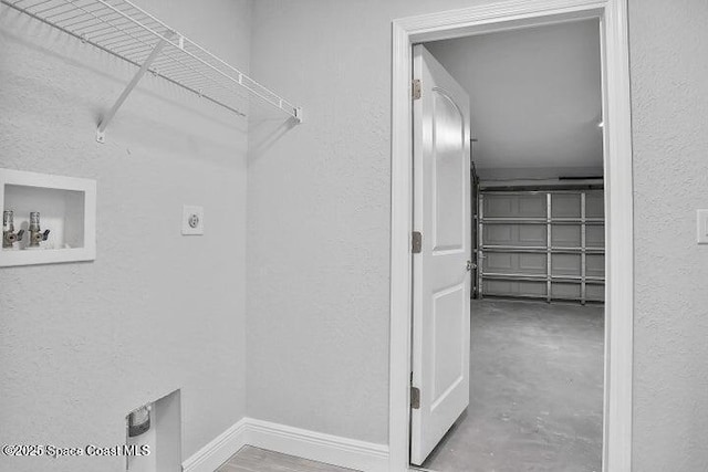 clothes washing area with hookup for an electric dryer and hookup for a washing machine