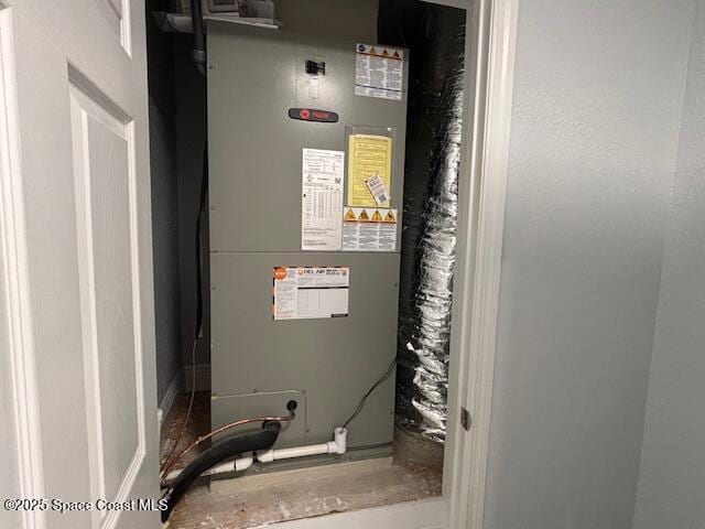 utility room with heating unit