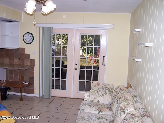 doorway featuring french doors and light tile patterned floors