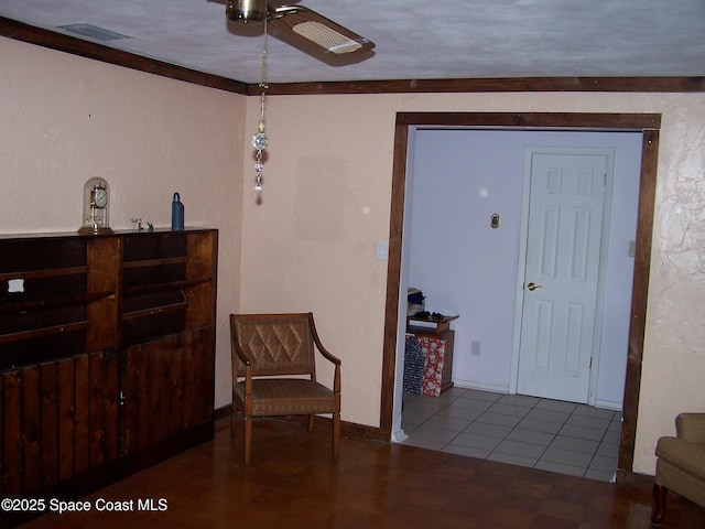 entryway with tile patterned floors and ceiling fan