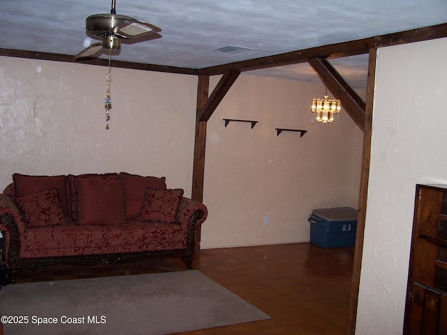 living room with ceiling fan with notable chandelier