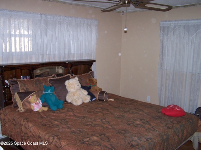 bedroom featuring ceiling fan