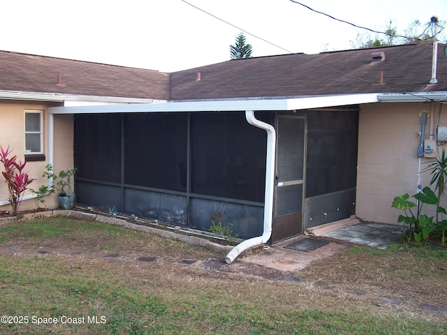 view of side of property with a sunroom