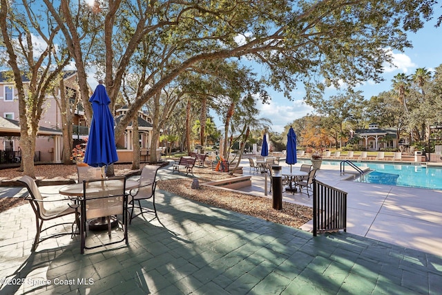 view of patio / terrace featuring a community pool