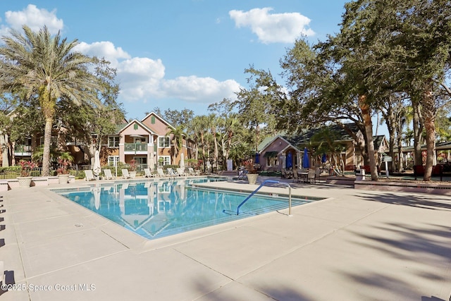 view of pool featuring a patio area