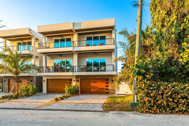 view of front facade with a balcony and a garage