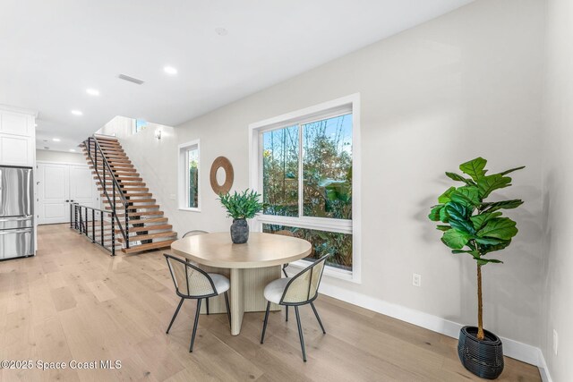 dining area with light wood-type flooring