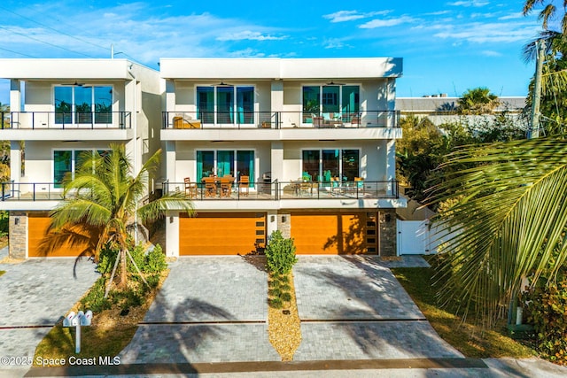 contemporary house with a balcony and a garage