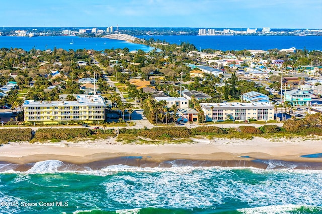 aerial view featuring a water view and a beach view