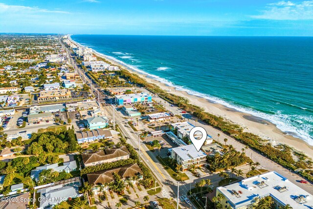 bird's eye view featuring a view of the beach and a water view