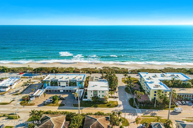 aerial view featuring a water view and a view of the beach