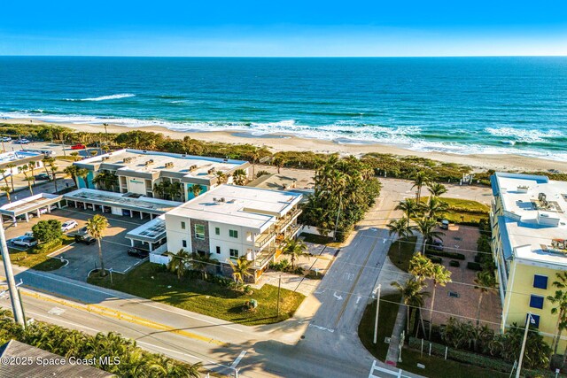 bird's eye view featuring a beach view and a water view