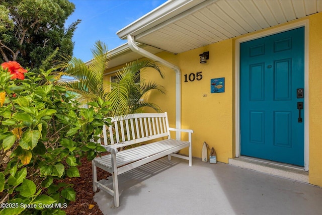 property entrance featuring covered porch