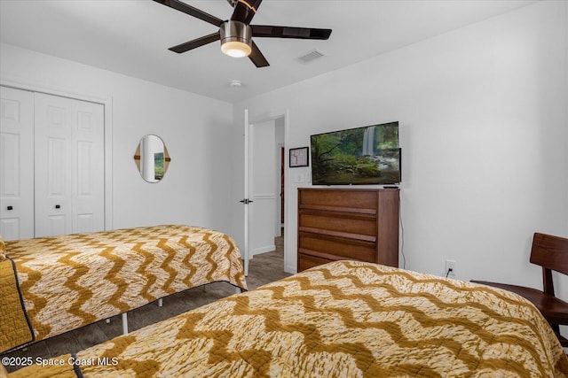 bedroom with ceiling fan, a closet, and hardwood / wood-style flooring