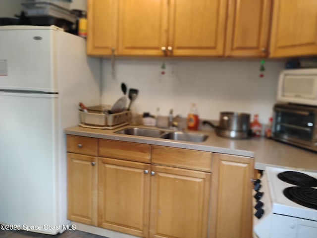 kitchen with sink and white appliances