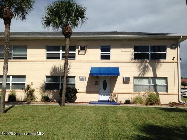 380 N Brevard Ave Unit C-1, Cocoa Beach, FL 32931 - view of front of property with a front yard