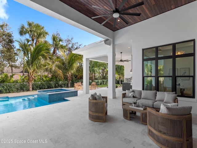 view of swimming pool with a ceiling fan, a pool with connected hot tub, an outdoor living space, fence, and a patio area