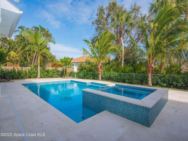 view of pool with a patio area, a fenced in pool, and fence