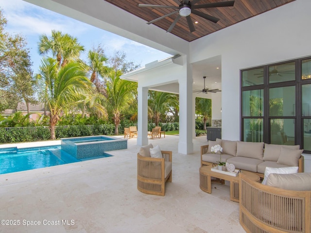 view of pool with a patio, a ceiling fan, fence, a pool with connected hot tub, and an outdoor hangout area