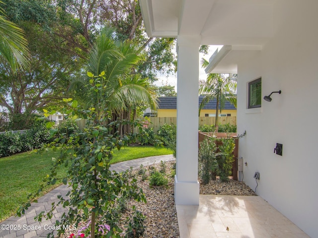 view of patio featuring fence