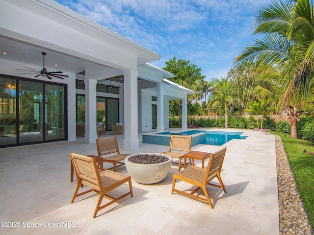 view of swimming pool with a fenced in pool, fence, ceiling fan, and a patio area