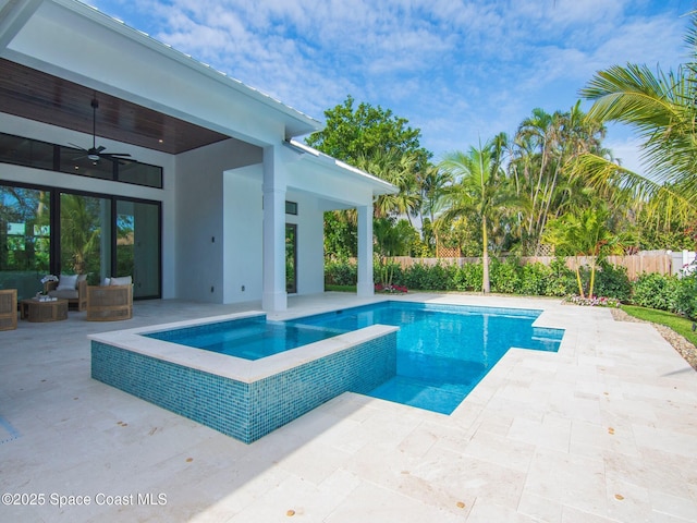 view of pool with a fenced backyard, a fenced in pool, a patio, and ceiling fan