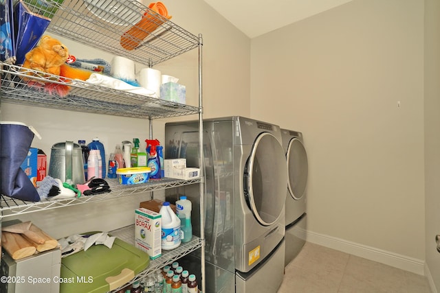 washroom with washer and dryer