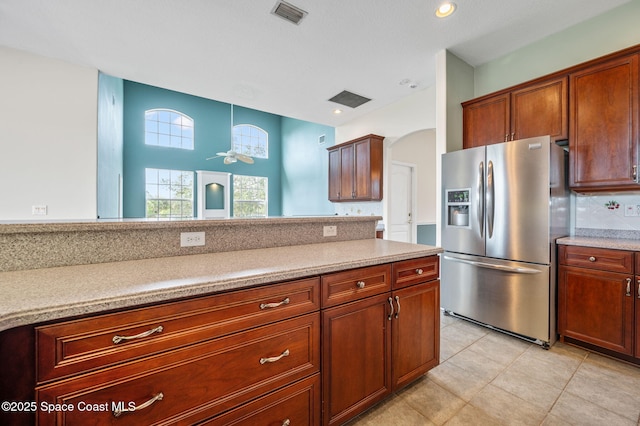 kitchen featuring stainless steel fridge, decorative light fixtures, light tile patterned floors, and ceiling fan