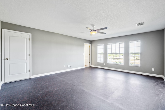 spare room with ceiling fan and a textured ceiling