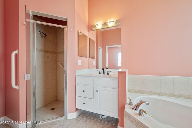 bathroom with tile patterned floors, vanity, and shower with separate bathtub