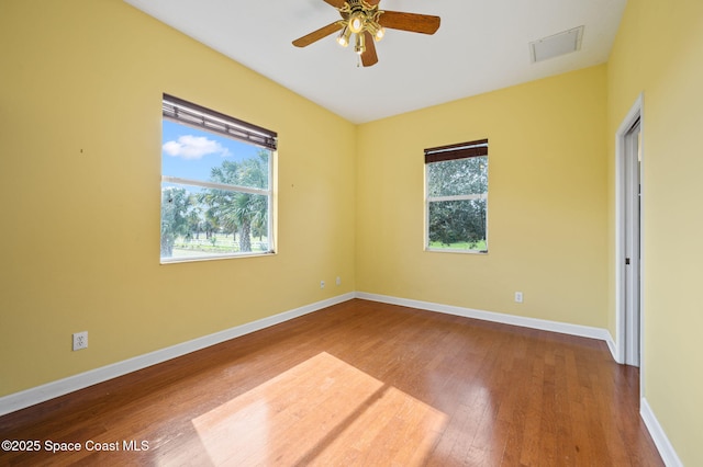 unfurnished room with hardwood / wood-style floors and ceiling fan