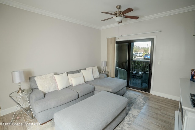 living room featuring ceiling fan, light hardwood / wood-style floors, and ornamental molding