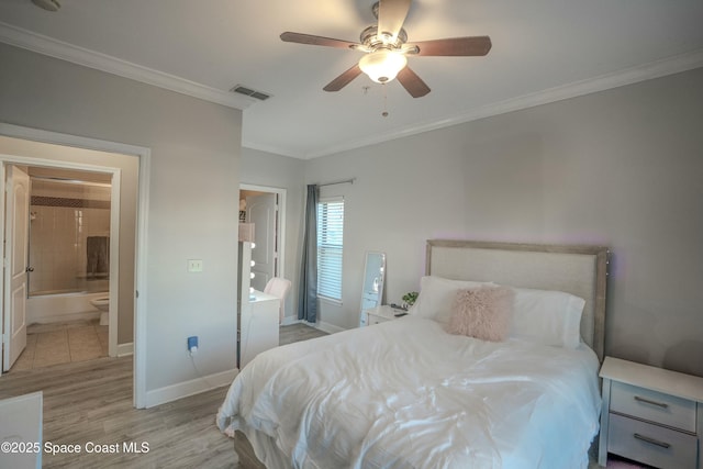 bedroom featuring connected bathroom, ceiling fan, crown molding, and light wood-type flooring