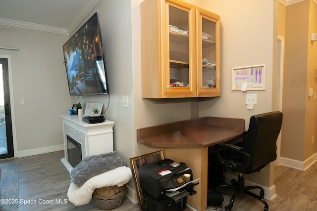 office area with crown molding and hardwood / wood-style flooring