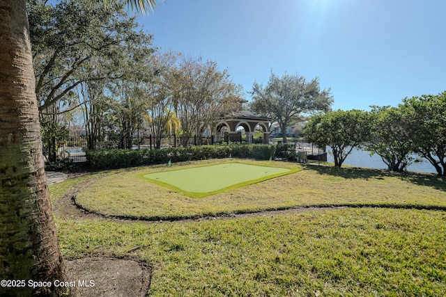 view of property's community with a gazebo and a water view