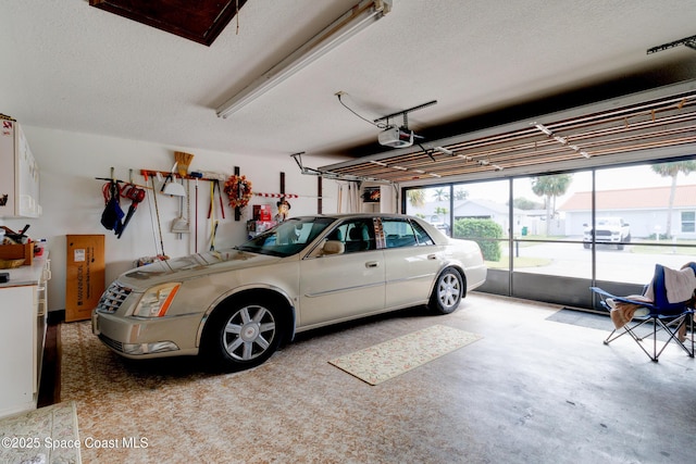 garage featuring a garage door opener