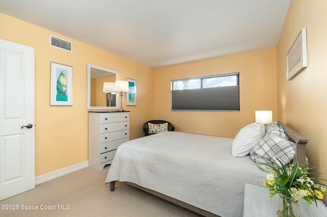 bedroom with light colored carpet